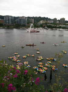 dozens of people floating in inflatable rings in a river