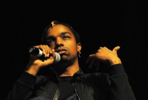 Michael Leverette holding a microphone in front of their face