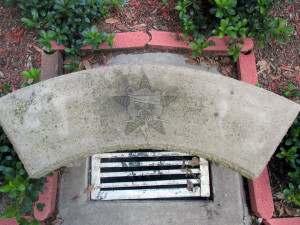 It's a picture of a drain with the Self Help Radio logo next to it.