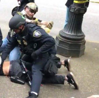 White supremacist assists police in arresting counter-protester White supremacist assists police in arresting counter-protester