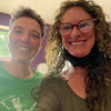 Two women smile into camera